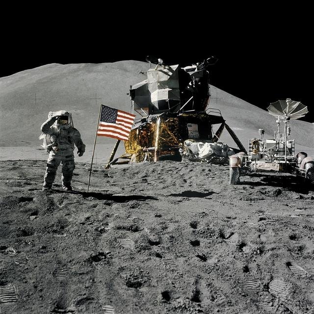 Apollo 12 Mission image - Dark view of Astronaut Alan L. Bean climbing down the ladder of the Lunar Module (LM)