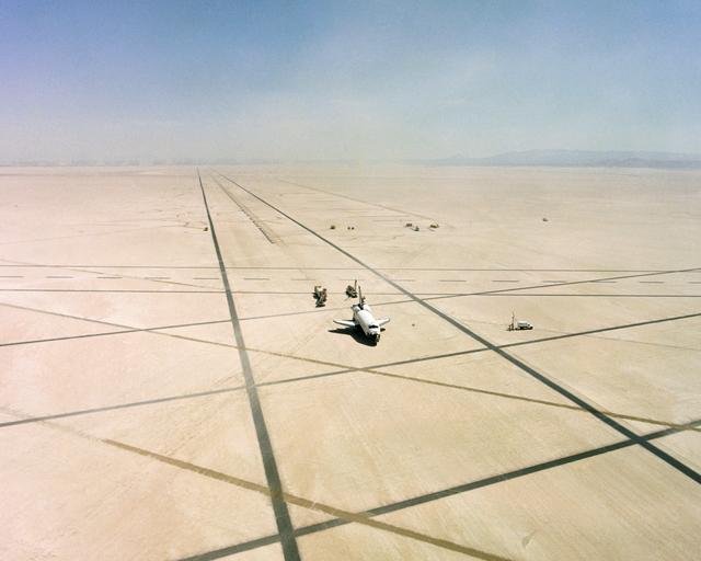 The Space Shuttle Columbia on Rogers Dry lakebed at Edwards AFB after landing to complete its first orbital mission on April 14, 1981