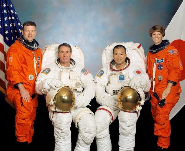 JOHNSON SPACE CENTER, HOUSTON, TEXAS -- (STS114-S-002) -- These four astronauts are in training for the STS-114 mission. Astronauts Eileen M. Collins, mission commander, and James M. Kelly, pilot, flank the two mission specialists -- astronauts Stephen K. Robinson (second from left) and Soichi Noguchi -- who are assigned to spacewalk duty to perform work on the International Space Station. Noguchi represents the Japanese Space agency.
